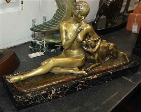 A French Art Deco bronze of a seated nude and dog, 28.5in.